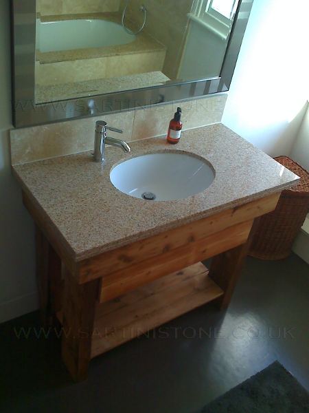 Granite worktop with under counter basin. Vanity unit made from reconstituted purlins and pine floorboards